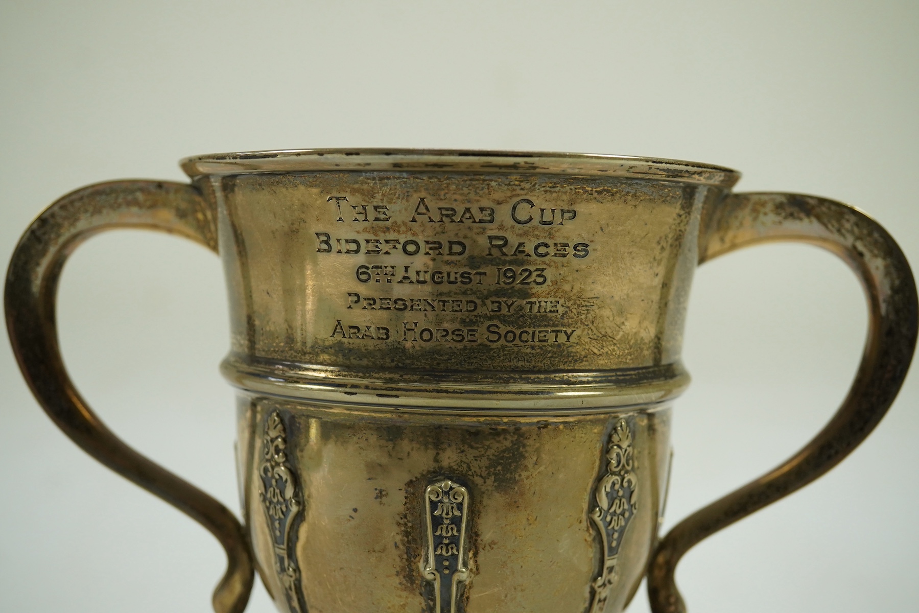 A George V silver two handled presentation trophy cup by The Goldsmiths & Silversmiths Co Ltd, with engraved horse racing inscription relating to 'The Arab Cup Bideford Races'